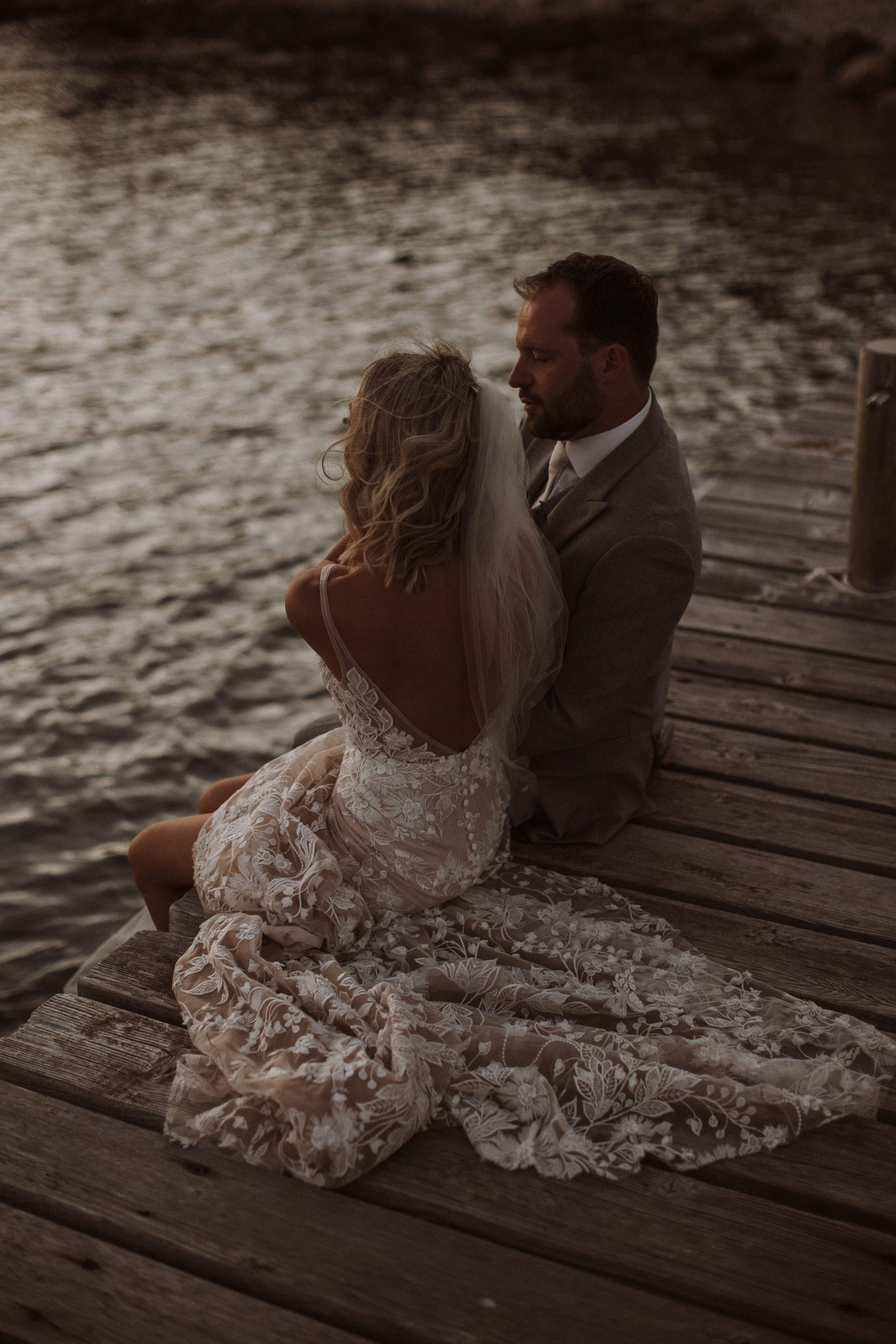 wedding couple destination beach dock water wedding dress sunset